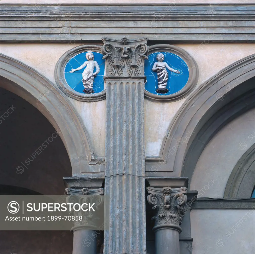 Italy, Tuscany, Florence, Archivio dello Spedale degli Innocenti. Blue glazed terra-cotta reliefs of swaddled babes next to a pilaster with Corinthian capital.