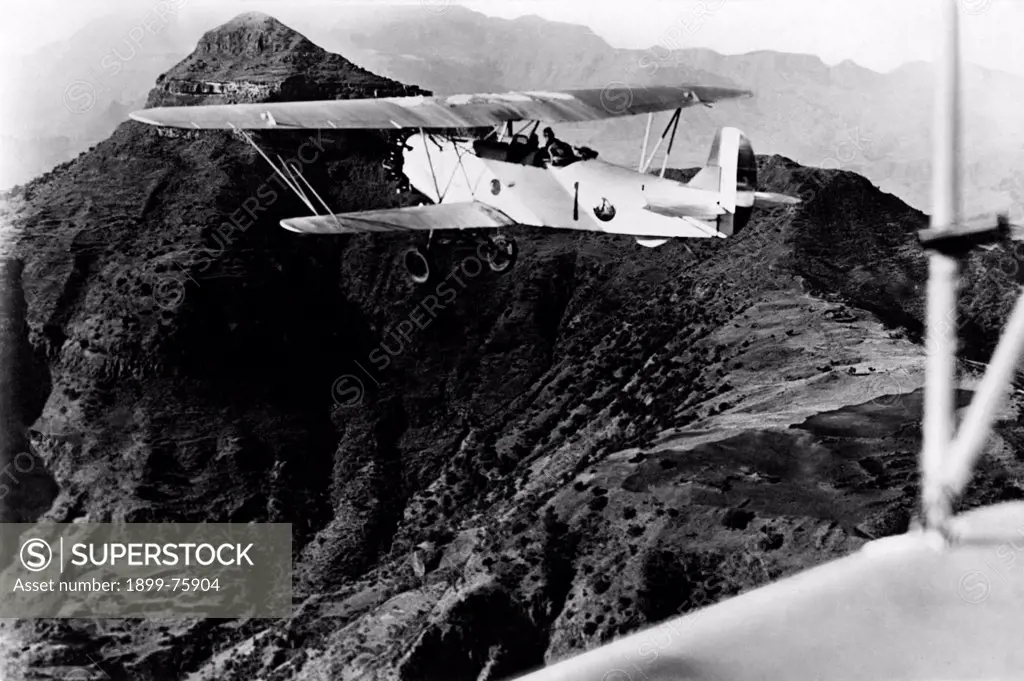 An aircraft of the Italian army flying over the mountain of Amba Alagi during the Second Italo-Ethiopian War. Ethiopia, February 1936