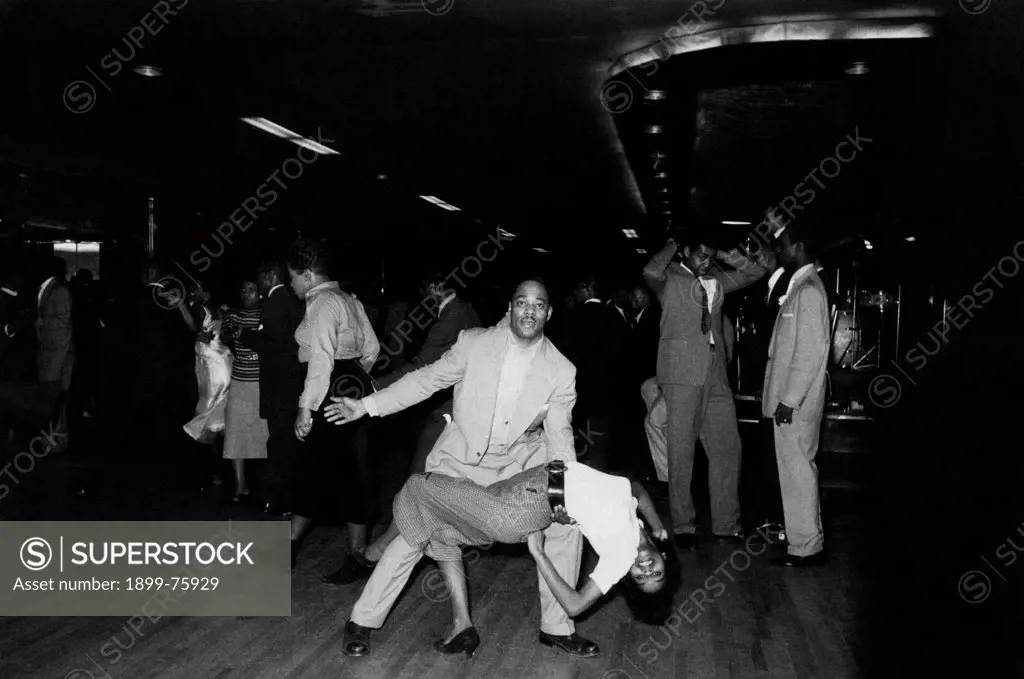 Two African-American people dancing rock 'n roll in a nightclub. New York, April 1959