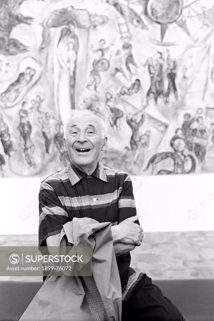 Russian-born French painter Marc Chagall (Moishe Segal) smiling in front of one of his works. Saint-Paul de Vence, September 1967.