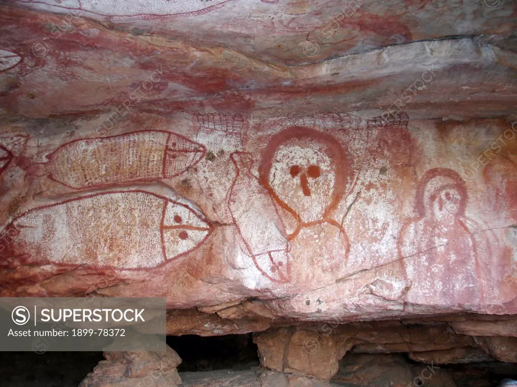 Wandjina, spirit figure painting, Ancestral Being with no mouth since the figure is believed to contain rain and a mouth would release continual rain over the land Raft Point Gallery, Kimberley Region, Western Australia