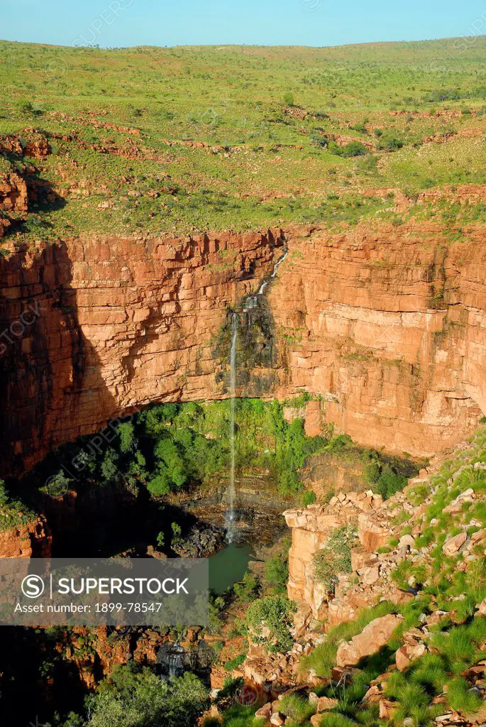 Late wet season waterfall in the rugged cliffs and gorges of ancient sedimentary rock, Mornington Wildlife Sanctuary, central Kimberley, Western Australia