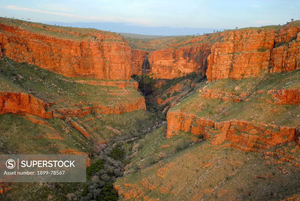 Dawn light illuminates the cliffs and gullies of ancient sedimentary rock, the King Leopold Ranges, Mornington Wildlife Sanctuary, central Kimberley, Western Australia