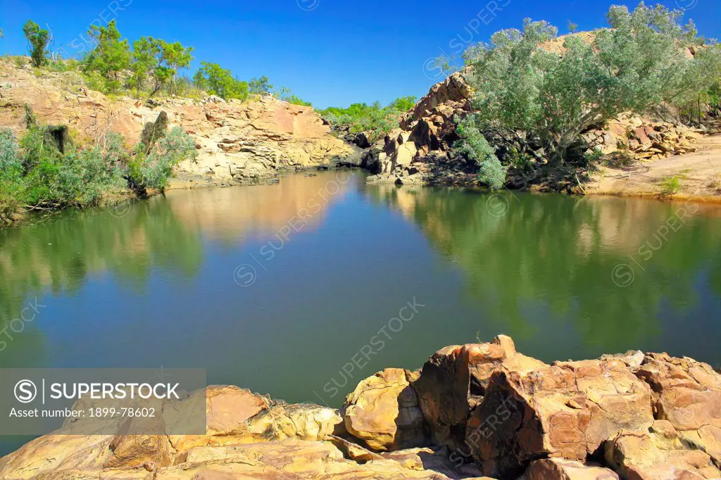 Waterhole with wetland vegetation upstream of Hellhole, Boiling Pot, gorge area, Broadmere Station, western Gulf of Carpentaria, Northern Territory, Australia