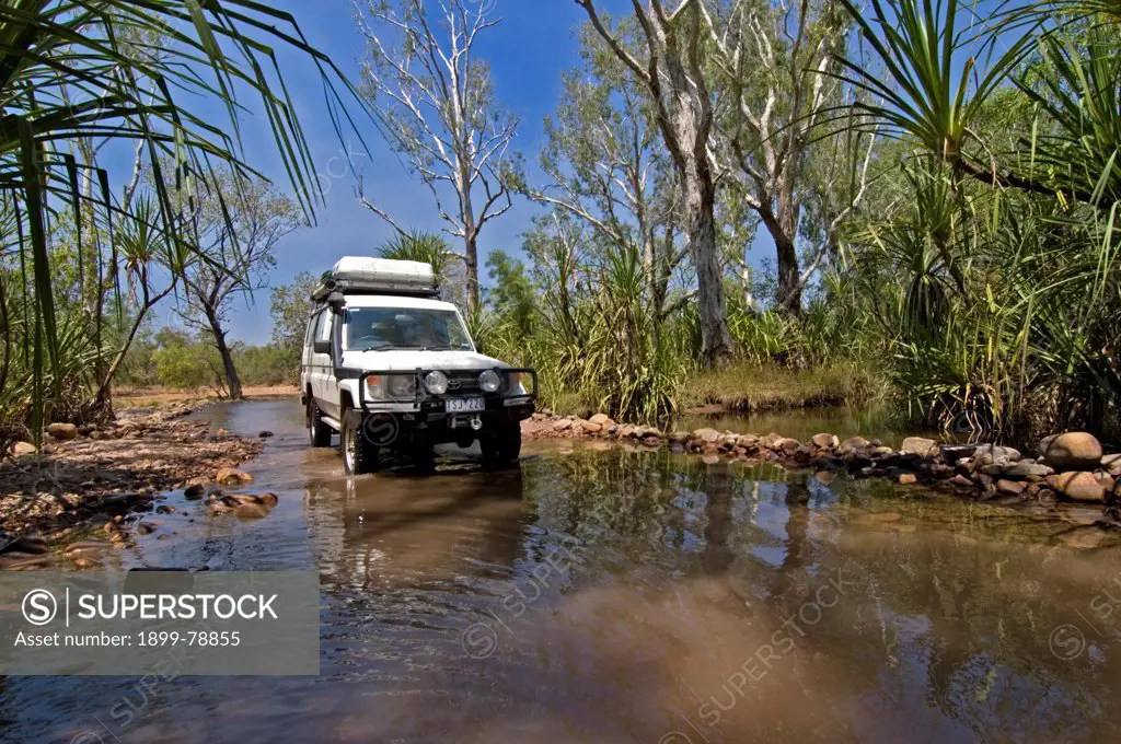 Four-wheel-drive vehicle crossing Pentecost River, El Questro Wilderness Park, Kimberley Region, Western Australia