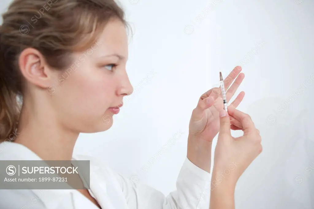 Nurse Preparing Syringe for Vaccination