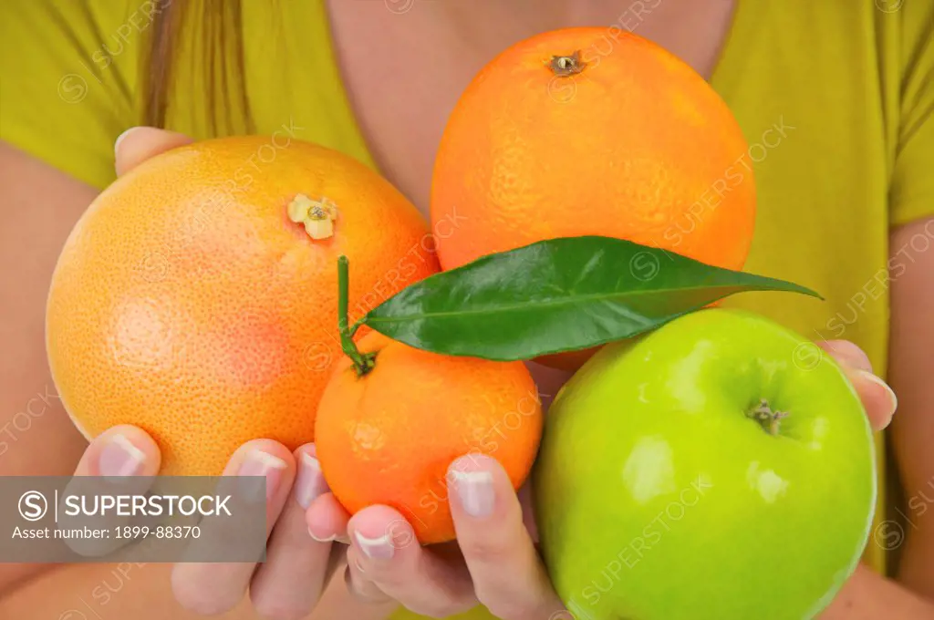 Woman holding Fresh Fruit