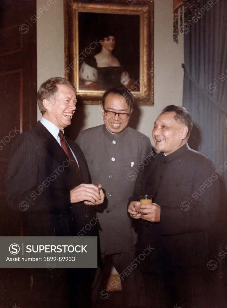 Chinese Vice-Premier Deng Xiaoping and US President Jimmy Carter having a conversation prior to their first-round talks at the White House on January 29, 1979.
