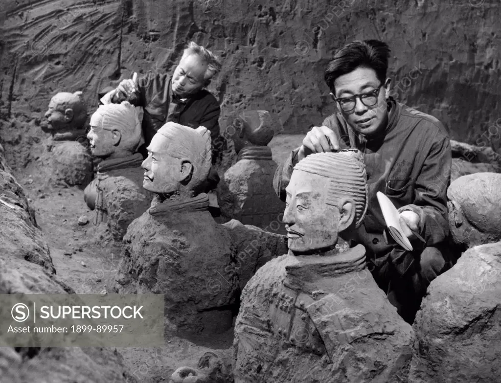 Archaeologists excavating terra-cotta warriors and horses at the tomb of the first emperor of China, Qin Shi Huang Ti in Xian, China. September 1979.