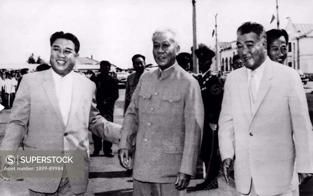 Liu Shao-chi (center), Chairman of the People's Republic of China and Vice-chairman of the Central Committee of the Communist Party of China, being greeted at the railway station in Pyongyang by Premier Kim Il Sung (left) and President Choi Yong Kun (right) of Korea. September 15, 1963.