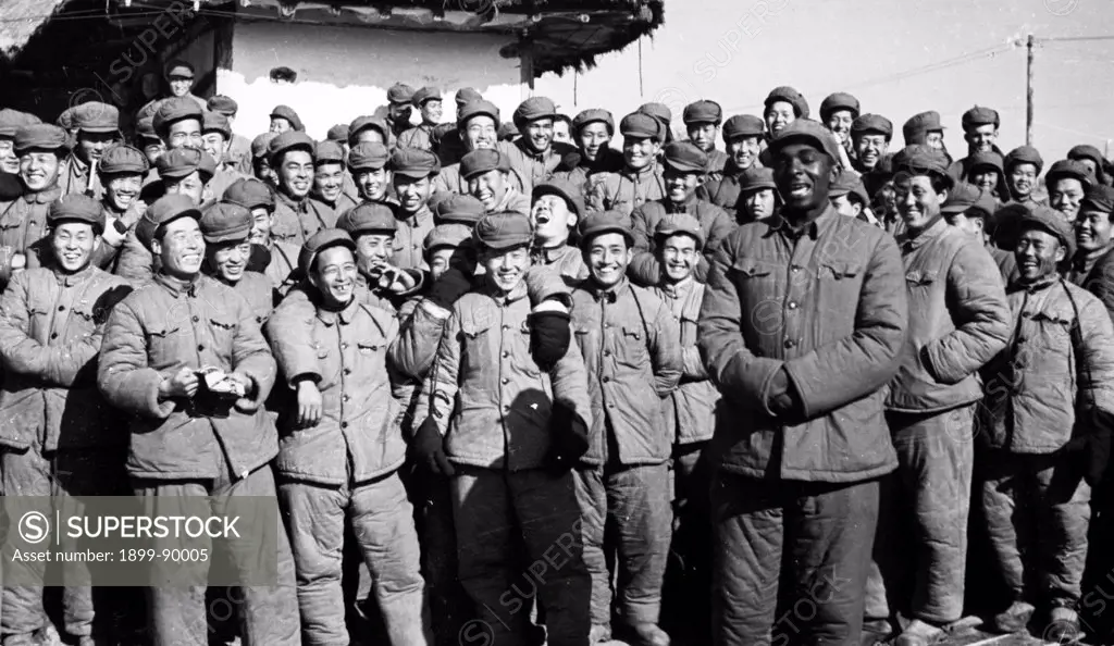 Korean War. American, British, and South Korean POW's who refused repatriation waiting for the Indian Red Cross representatives to turn over their rosters to the representatives of the Red Cross Societies of Korea and China. February 1954. An African American prisoner from Kansas City is singing a Chinese folk song in Korean to entertain his companions at the Songgongni camp while they wait.