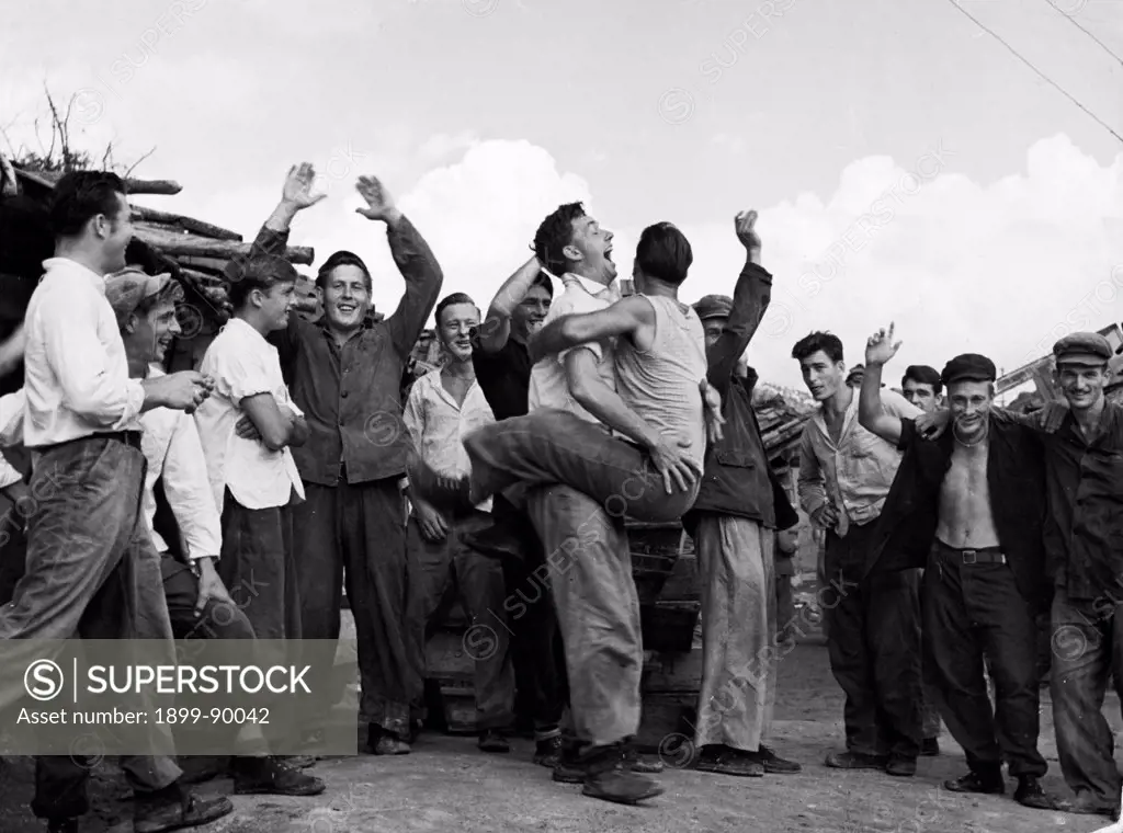 Korean War. American prisoners in a North Korean POW camp celebrating upon hearing news of the armistice. August 1953.
