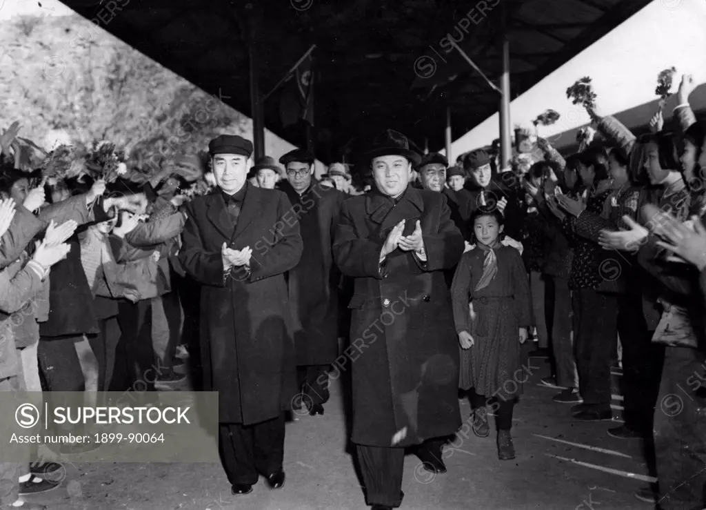 Korean War. The Korean Government Delegation headed by Marshal Kim Il Sung (right) being greeted at the railway station in Peking by Chou En-lai (left) during their visit on November 12, 1953.