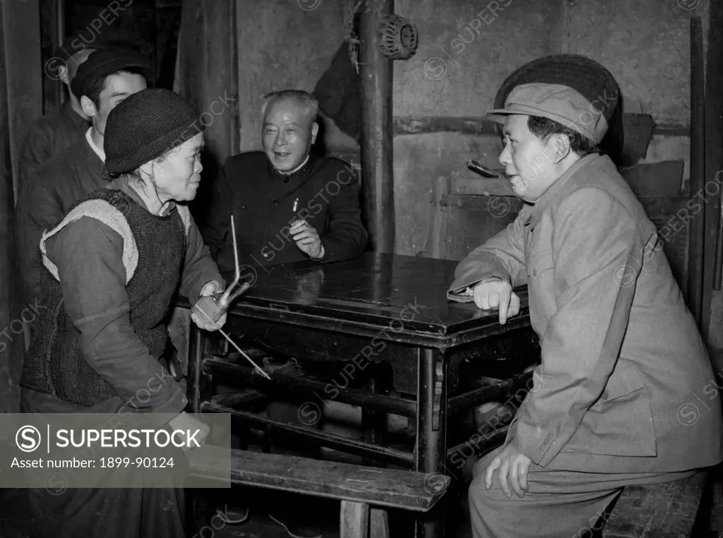 Chairman Mao Zedong talking to an old woman, Mother Wen, during his inspection of the Red Light Agricultural Producer's Cooperative in Hesing Hsiang, Pi County, Szechuan Province, China. April 1958.