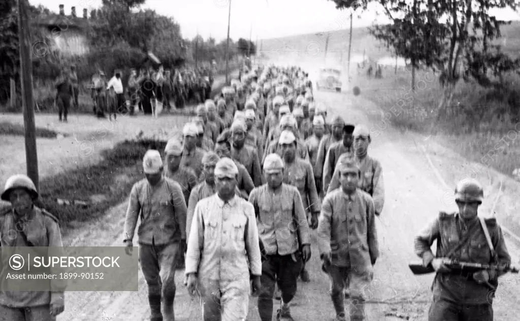 Operation August Storm (Battle of Manchuria). Japanese prisoners being led by Red Army troops in Li-shenchen. Manchuria. August 1945.