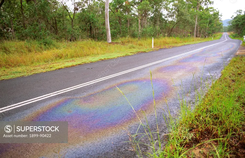 Oil slick on highway showing need for catchment management, Queensland, Australia. 01/11/2001