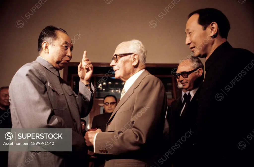 The President of Italy Sandro Pertini shakes hands with Hua Guofeng, Premier of the People's Republic of China and Chairman of the Communist Party of China, during his diplomatic tour in the Far East; both politicians are accompanied by the staff of their delegations. Beijing (China), September 1980.