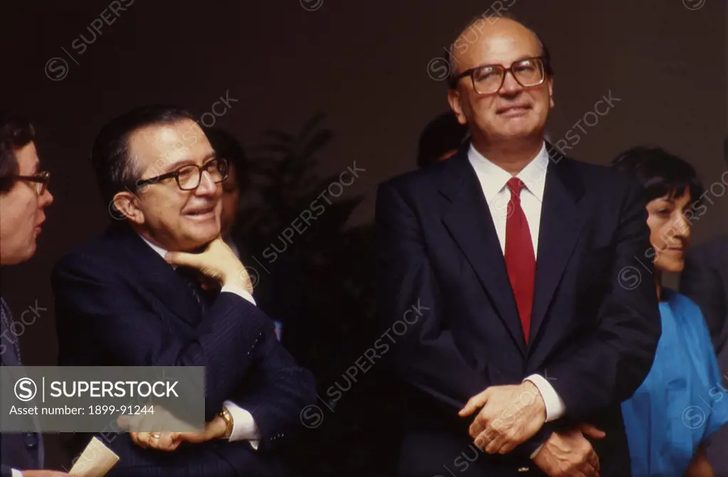 Giulio Andreotti, leader of the Christian Democratic Party, is smiling next to Bettino Craxi, head of the Italian Socialist Party. Italy, 1980.