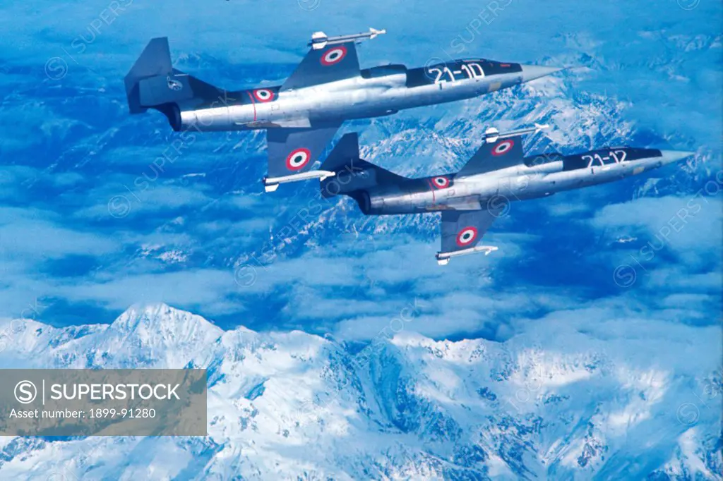 Pair of supersonic aircraft F104 G of the Italian Airforce, 21 Squadron stationed at Cameri (Novara), during a training flight over the Alps in 1970.