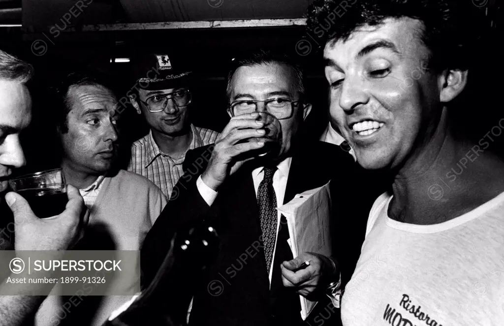 Italian journalist and member of the Parliament Giulio Andreotti drinking at the National Friendship Day organized by the Christian Democratic Party (DC). Trento, 1981