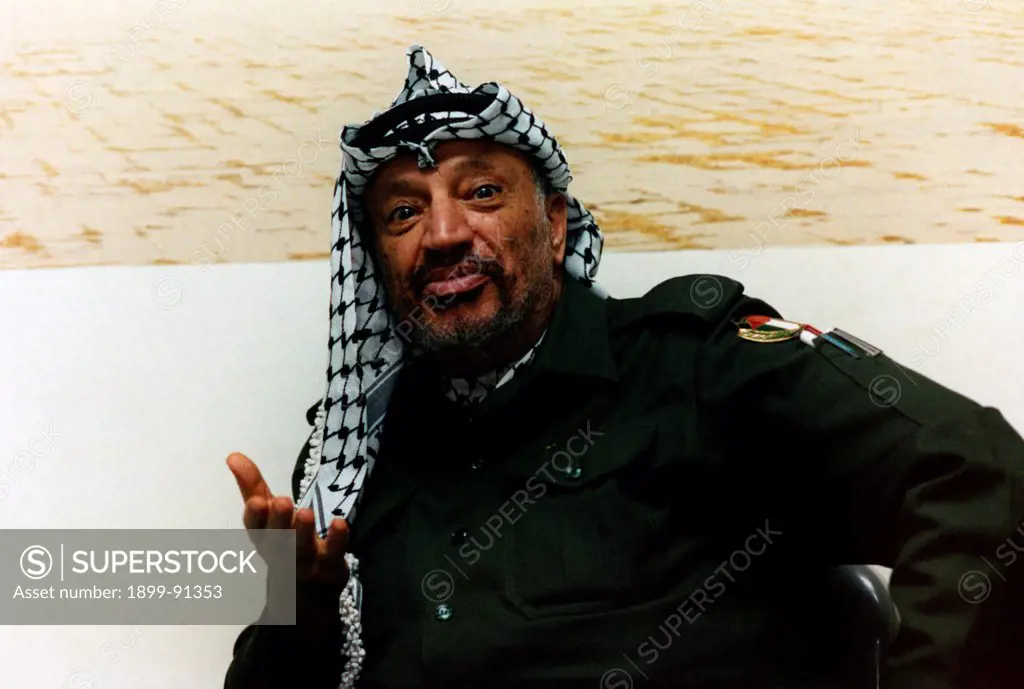 Palestinian politician and President of the Palestine Liberation Organization Yasser Arafat talking wearing a keffiyeh. Tunis, 1980s