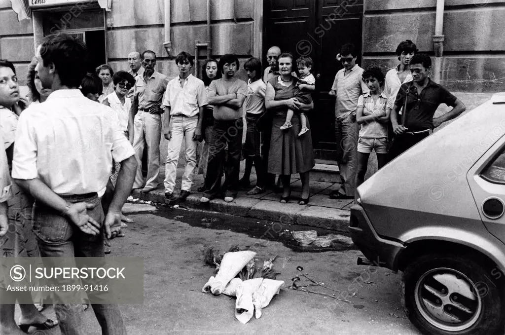 Some people laid some bunch of flowers where Italian general and Prefect Carlo Alberto Dalla Chiesa and his wife Emanuela Setti Carraro were murdered. Palermo, 4th September 1982