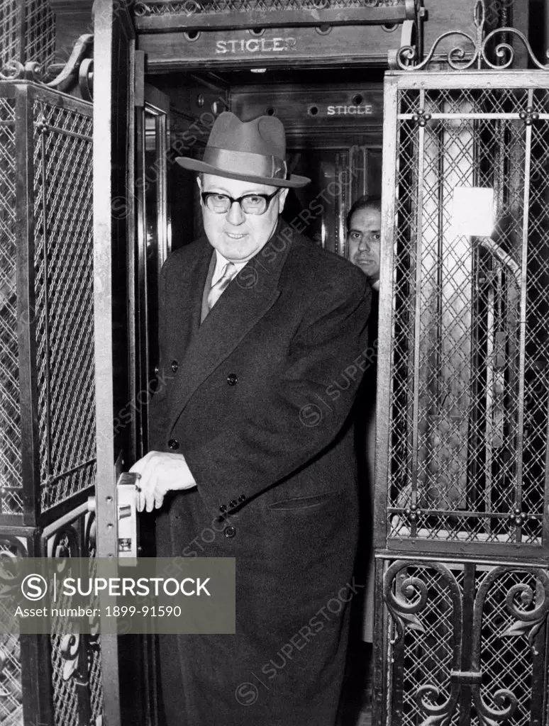 Italian deputy Giuseppe Saragat coming out from an elevator. Giuseppe Saragat attended a meeting with the leadership of Italian Democratic Socialist Party (PSDI) after the resignation of the President of the Council of Ministers of the Italian Republic Amintore Fanfani. Rome, 1959