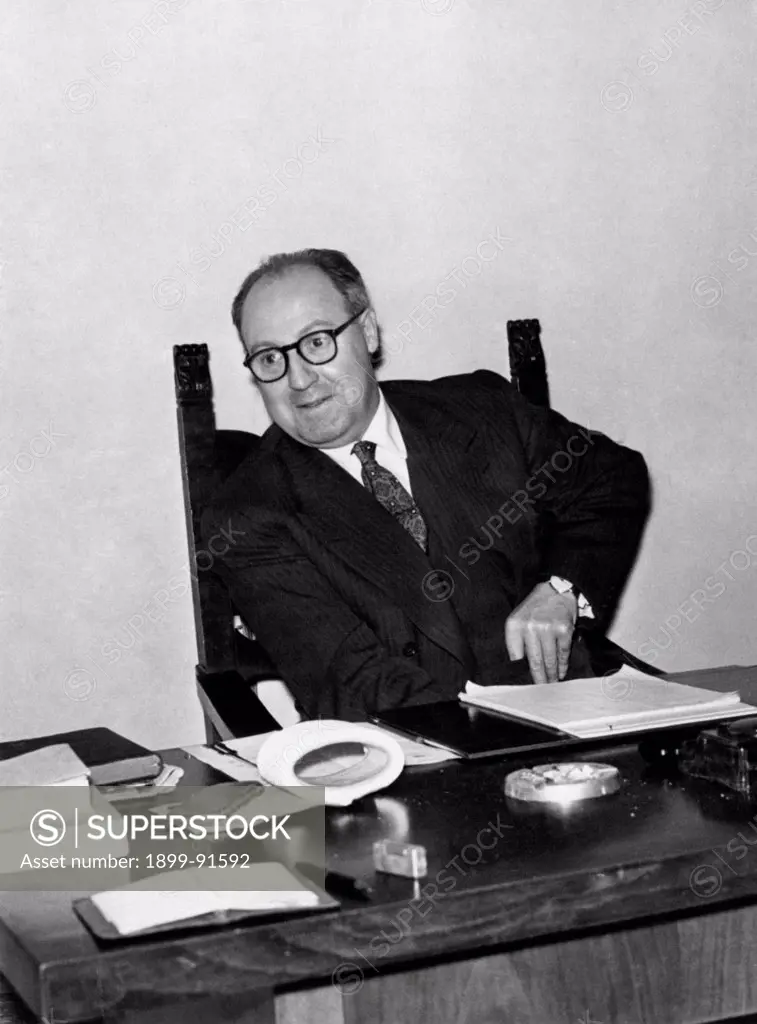 Italian deputy and Secretary of Italian Democratic Socialist Party (PSDI)Giuseppe Saragat sitting at the desk. 1953