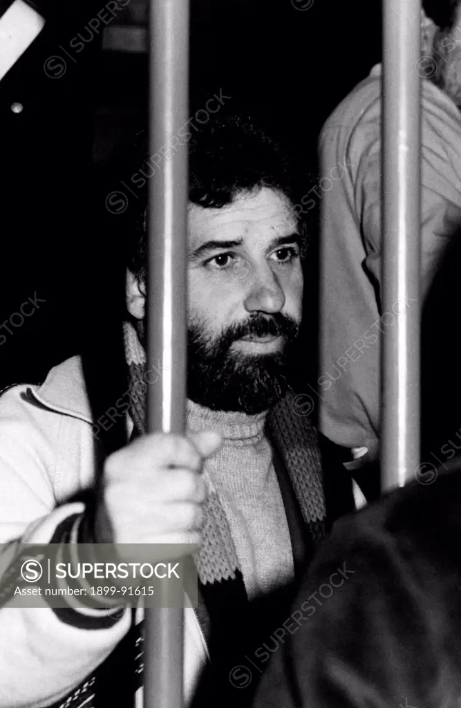 Italian terrorist Renato Curcio, founder and ideologist of the left-wing terrorist group Red Brigades, clenching a bar with his hand during the trial against forty-six members of the group. Renato Curcio is charged with organization of an armed group targeting the violent suppressing of legal, economic and political systems of Italian State. Turin, March 1978
