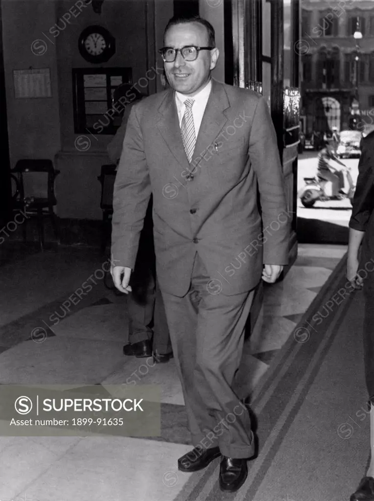 Italian Christian Democrat deputy Mariano Rumor walking smiling. December 1956