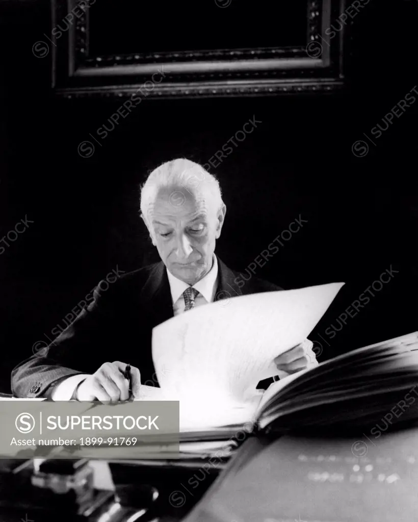 The President of the Italian Republic Antonio Segni reading some papers sitting at the desk of his study at Quirinale. Rome, 20th June 1962