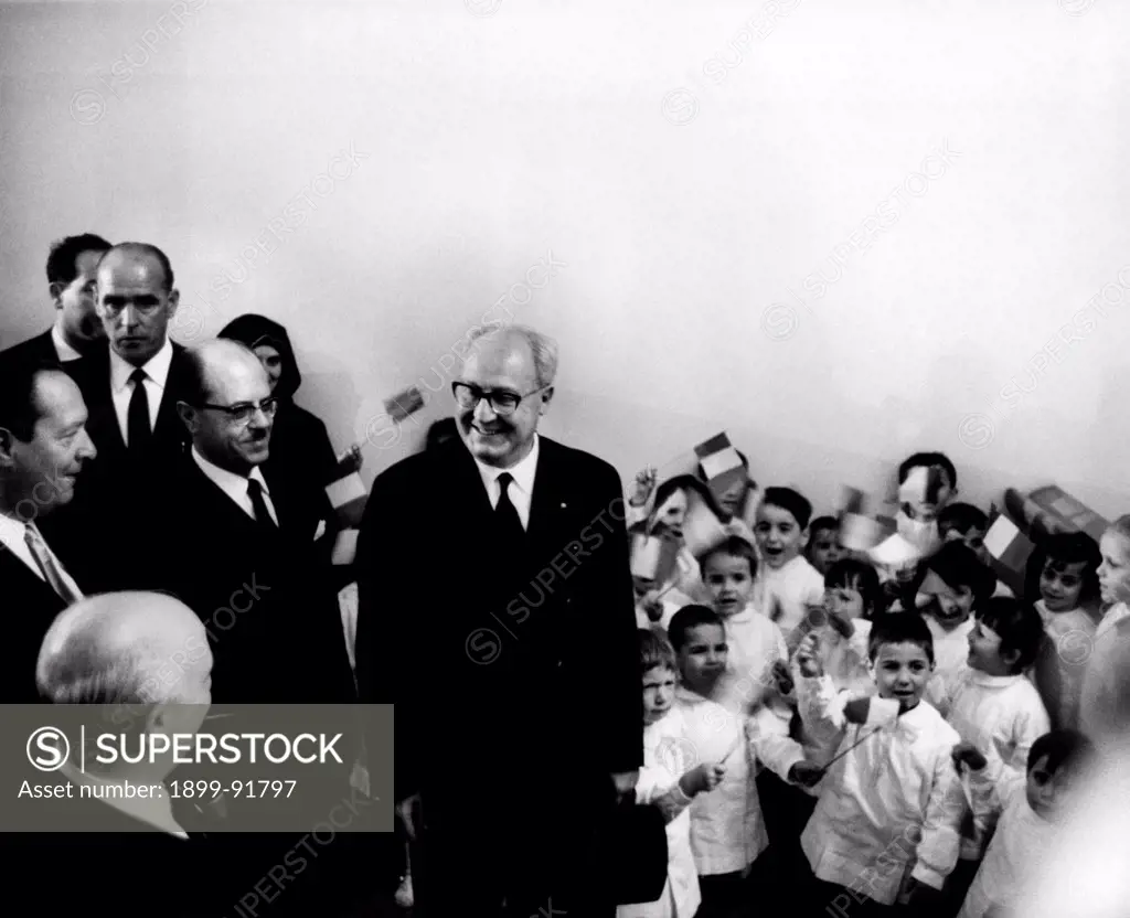 Some German children welcoming the President of the Italian Republic Giuseppe Saragat and the Minister of Foreign Affairs of the Italian Republic Amintore Fanfani waving small Italian flags. Germany, July 1965