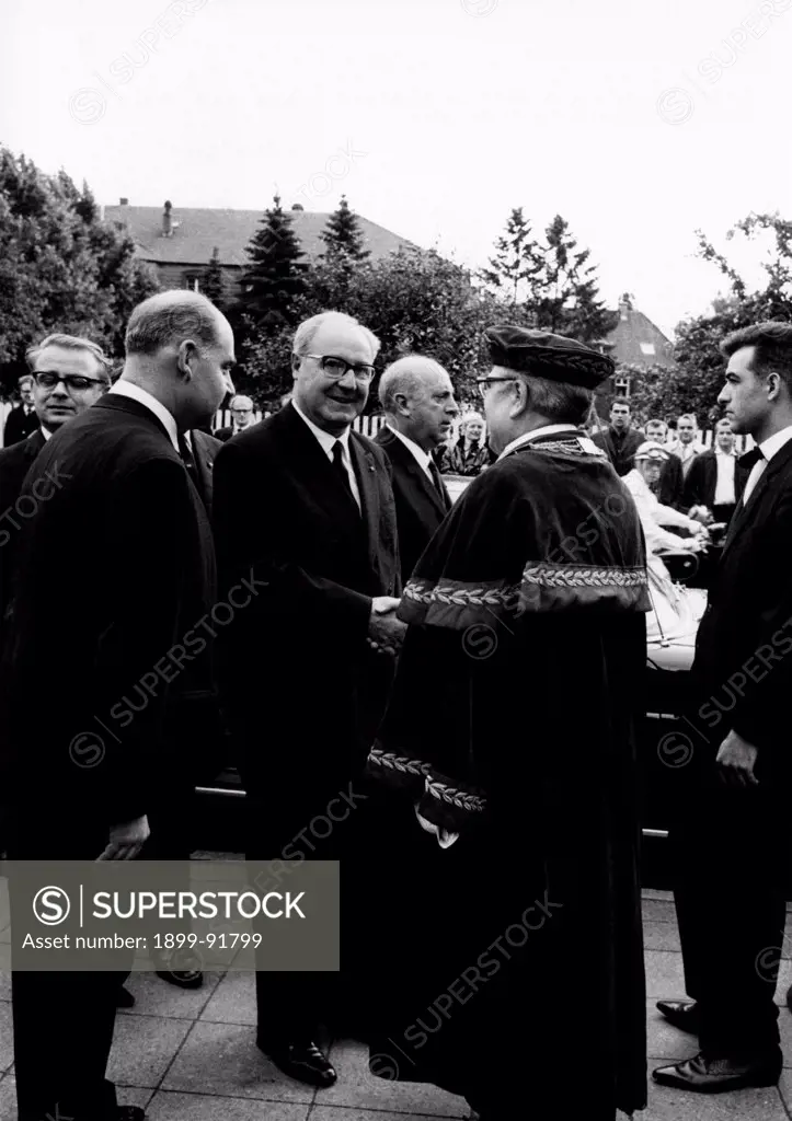 The President of the Italian Republic Giuseppe Saragat shaking hands with German Chancellor of the Freie Universitaet Herbert Luers. Berlin, July 1965