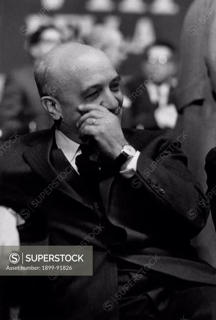 Prime Minister of Italy Amintore Fanfani smiling sitting at Teatro San Carlo during the 8th national congress of the Christian Democratic Party, sanctioning the openness of the party to the left. Naples, January 1962