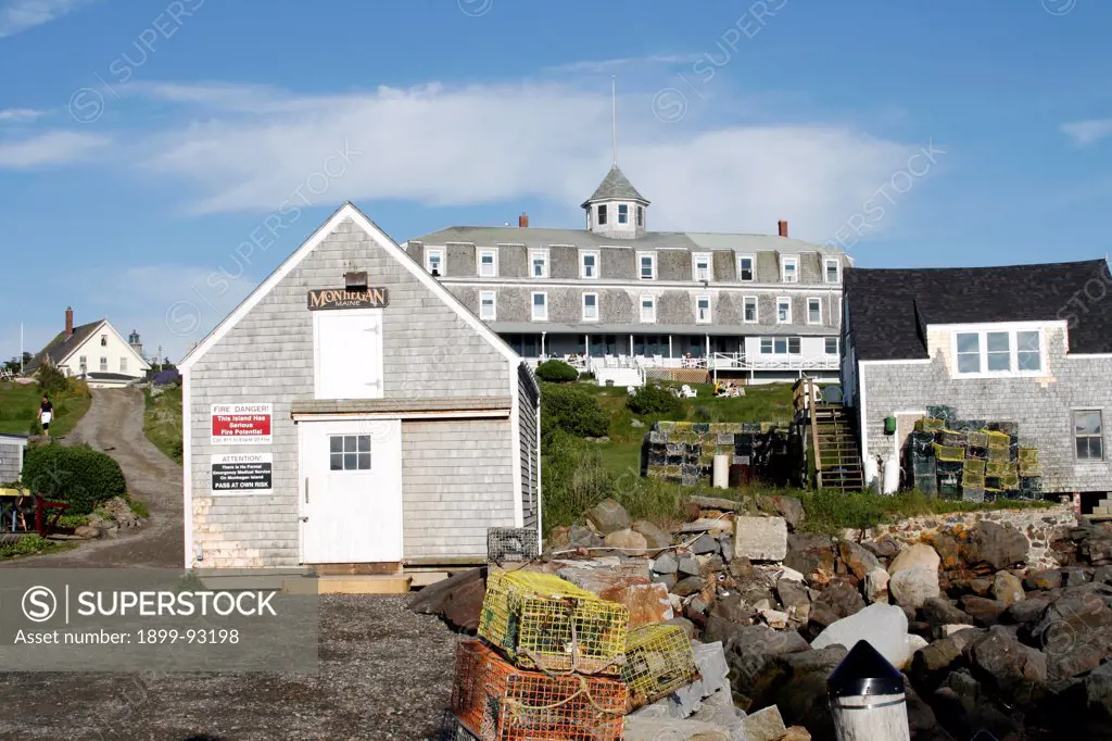 Maine coast Monhegan Island New England USA remote offshore stone town pier lobster pots fishing The Island Inn.