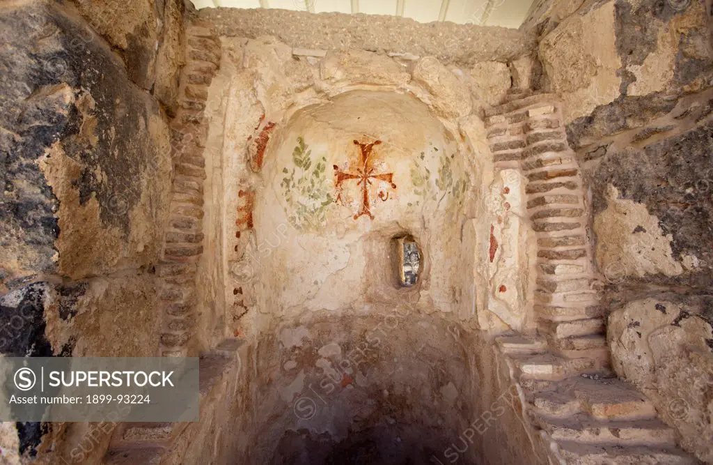 Byzantine cross painted on a wall of an ancient Roman bath in Beit Shean National Park, Israel. (Photo by: Independent Picture Service/UIG via Getty Images)