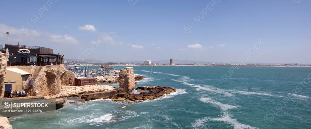 Panoramic view showing a seaside restaurant, harbor, and Bay of Haifa in Acre, Israel. (Photo by: Independent Picture Service/UIG via Getty Images)