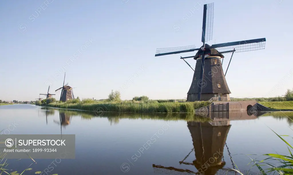 Windmills at Kinderdijk, Netherlands. (Photo by: Geography Photos/UIG via Getty Images)