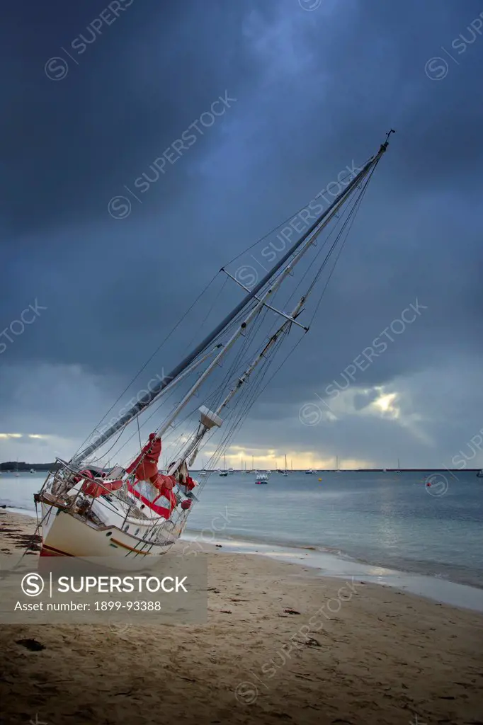 Boat washed ashore after breaking its moorings during wild weather, Rockingham, Western Australia,6/14/2011