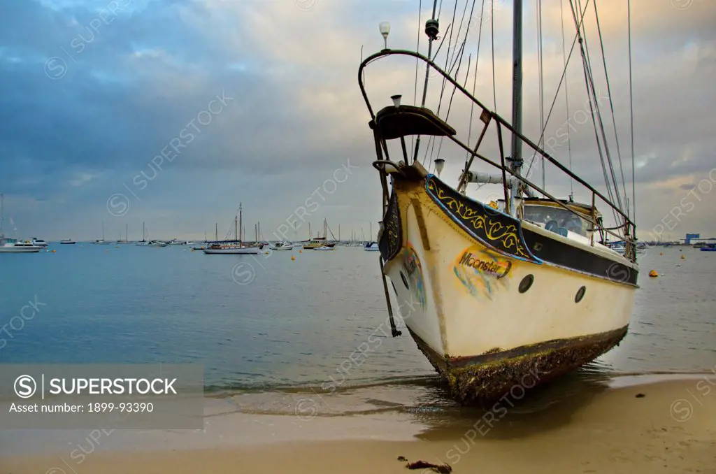 Boat washed ashore after breaking its moorings during wild weather, Rockingham, Western Australia,6/14/2011