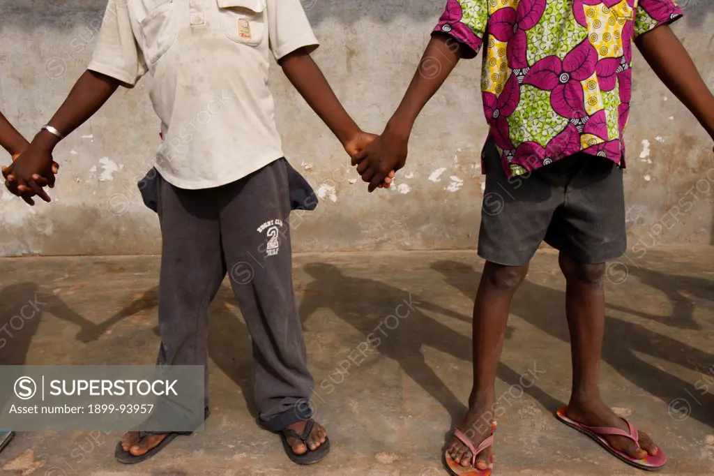 African schoolchildren holding hands,06/28/2010