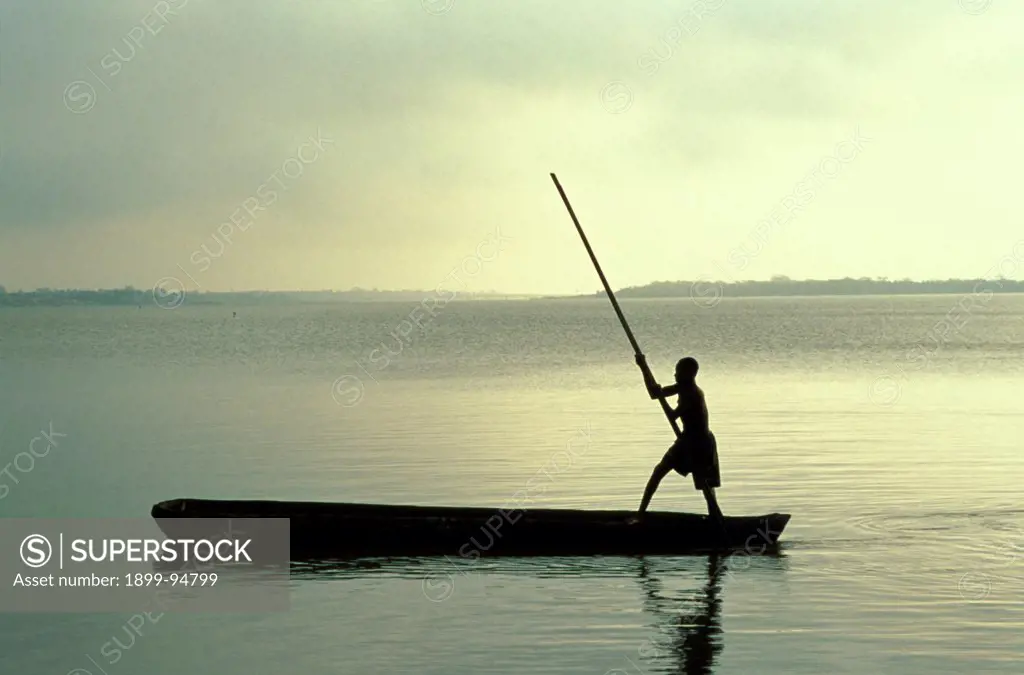 Boy rowing on Lake Togo, Aneho, Togo.,11/14/2001