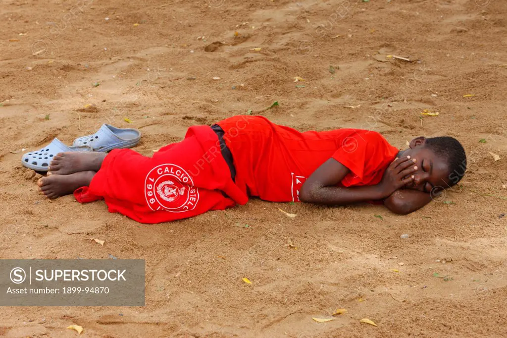 Boy sleeping, Lome, Togo.,06/05/2009