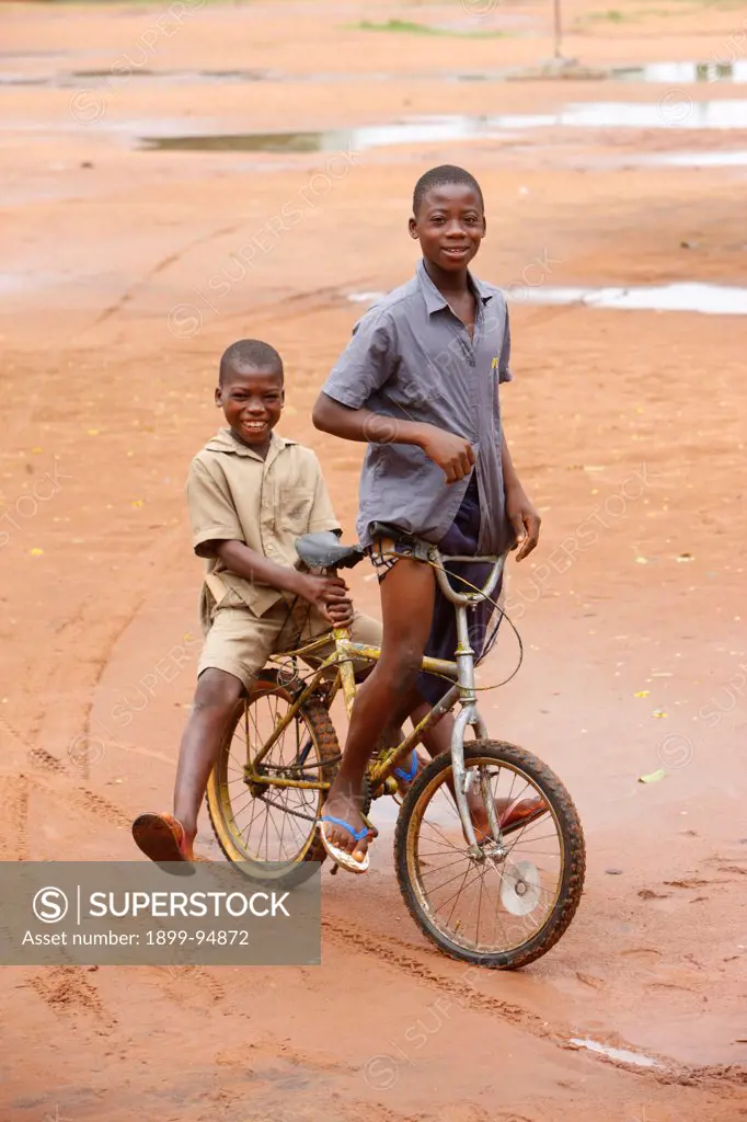 2 boys on a bicycle, Lome, Togo.,06/04/2009