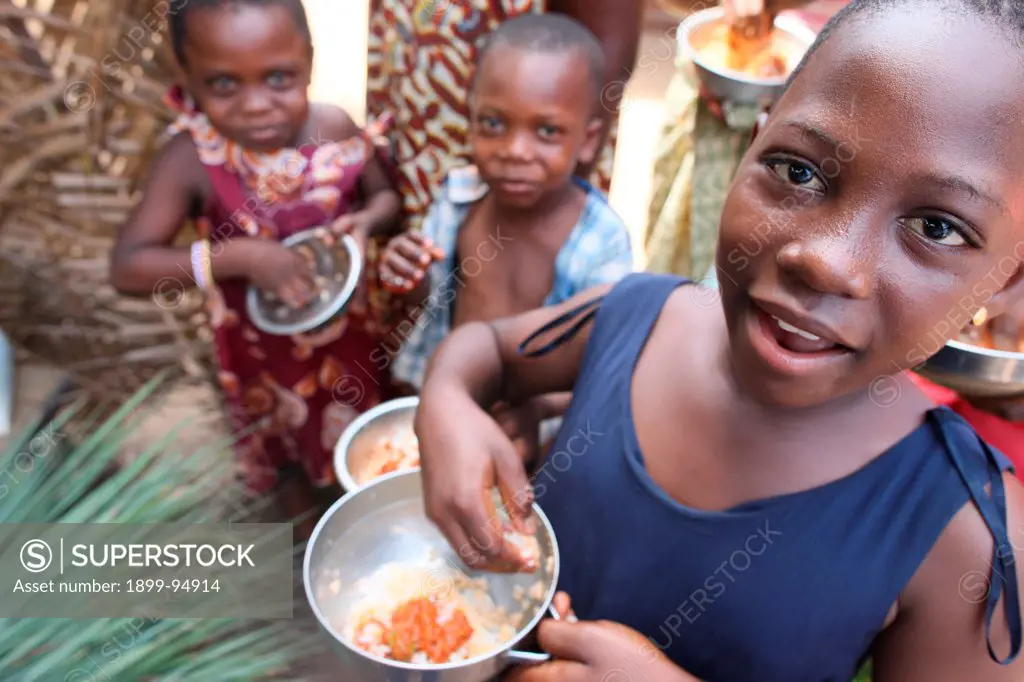 Children eating an african meal, Lome, Togo.,10/16/2011