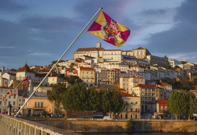 Coimbra, Portugal seen across the Mondego river, The flag is of the city of Coimbra