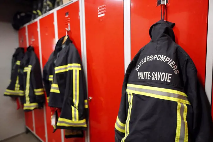 Fire department.   Fireman coats wait for the next call. Locker room.  French Sapeurs Pompiers. France. 