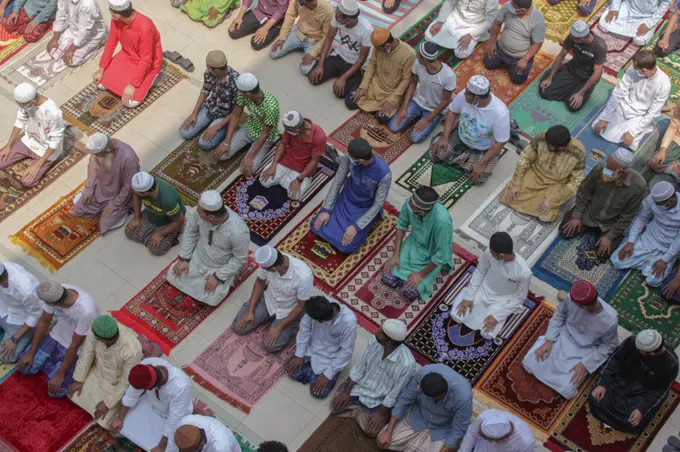 Muslims attend Jumma prayer during Ramadan at the ShahJalal Dargah Mosque. The country is also in lockdown to combat the second wave of the coronavirus pandemic. Sylhet, Bangladesh.