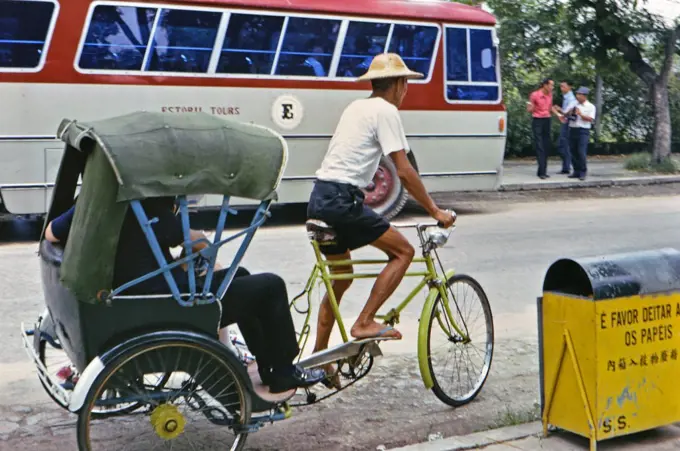 (R) 1973 - Man pedaling a pedicycle in Macau circa early 1970s.