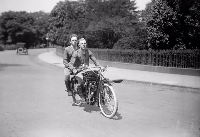 Transcontinental Motorcyclists Balcer & O'Brien circa 1915 (riding their motorcycle). 